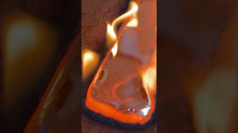 Pouring molten silver into clay